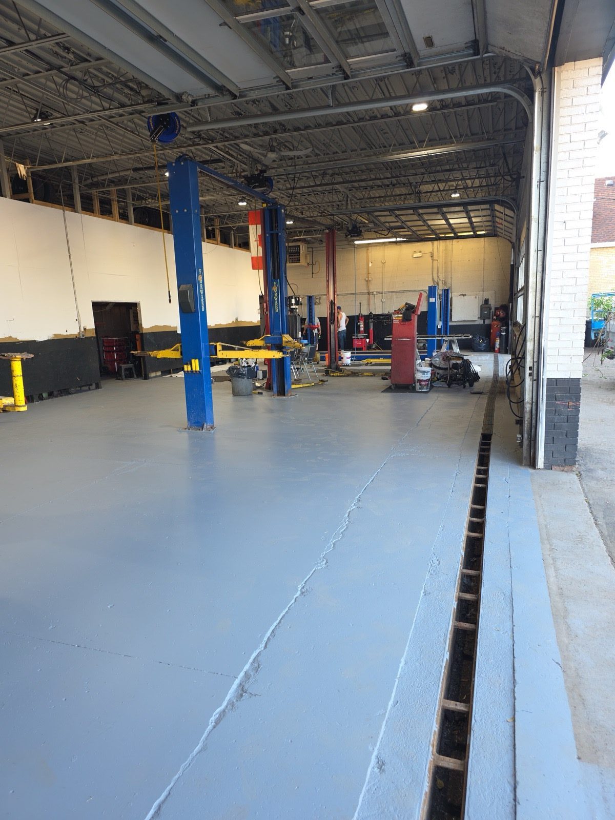 Inside the shop — service bays with vehicle lifts